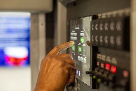 A man utilizing the Frontline Communications Command Zone™ Electrical Systems Screen.