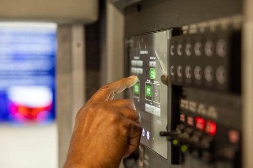 A Frontline Communications team member servicing the interior of a vehicle.