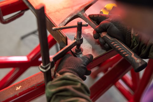 A Frontline Communications team member working in the production facility.
