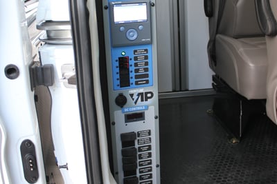 The interior of a small communications vehicle shows the VIP Power System inverter generator up close. 