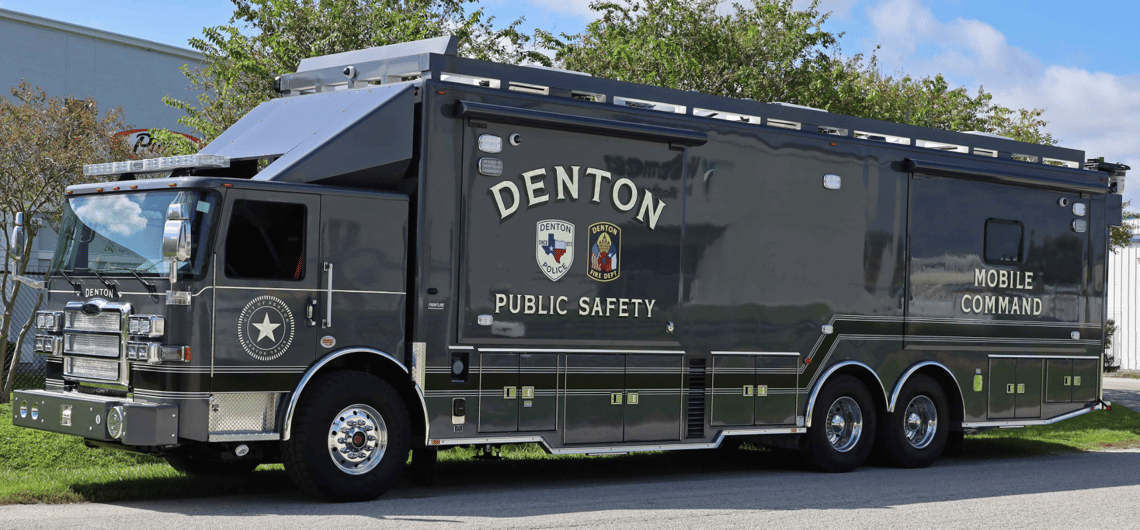 A Mobile Command Vehicle for Denton Public Safety sitting outside on a sunny day.