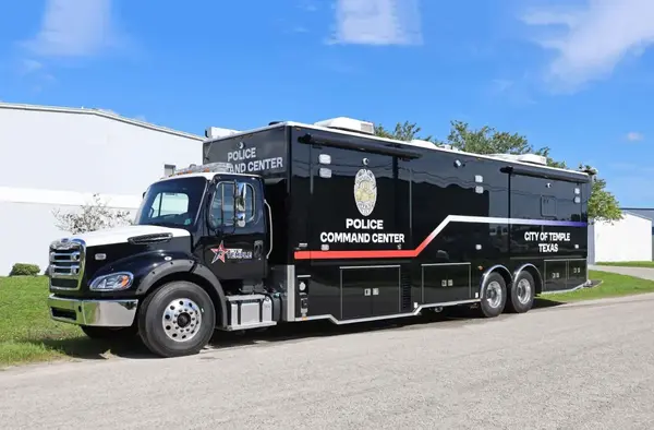 A Frontline Communications Mobile Command Vehicle for Temple Police Department parked outside on a sunny day.