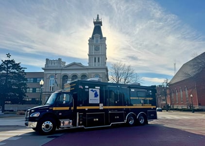 Mobile Command Vehicle parked outside on a cloudy day.