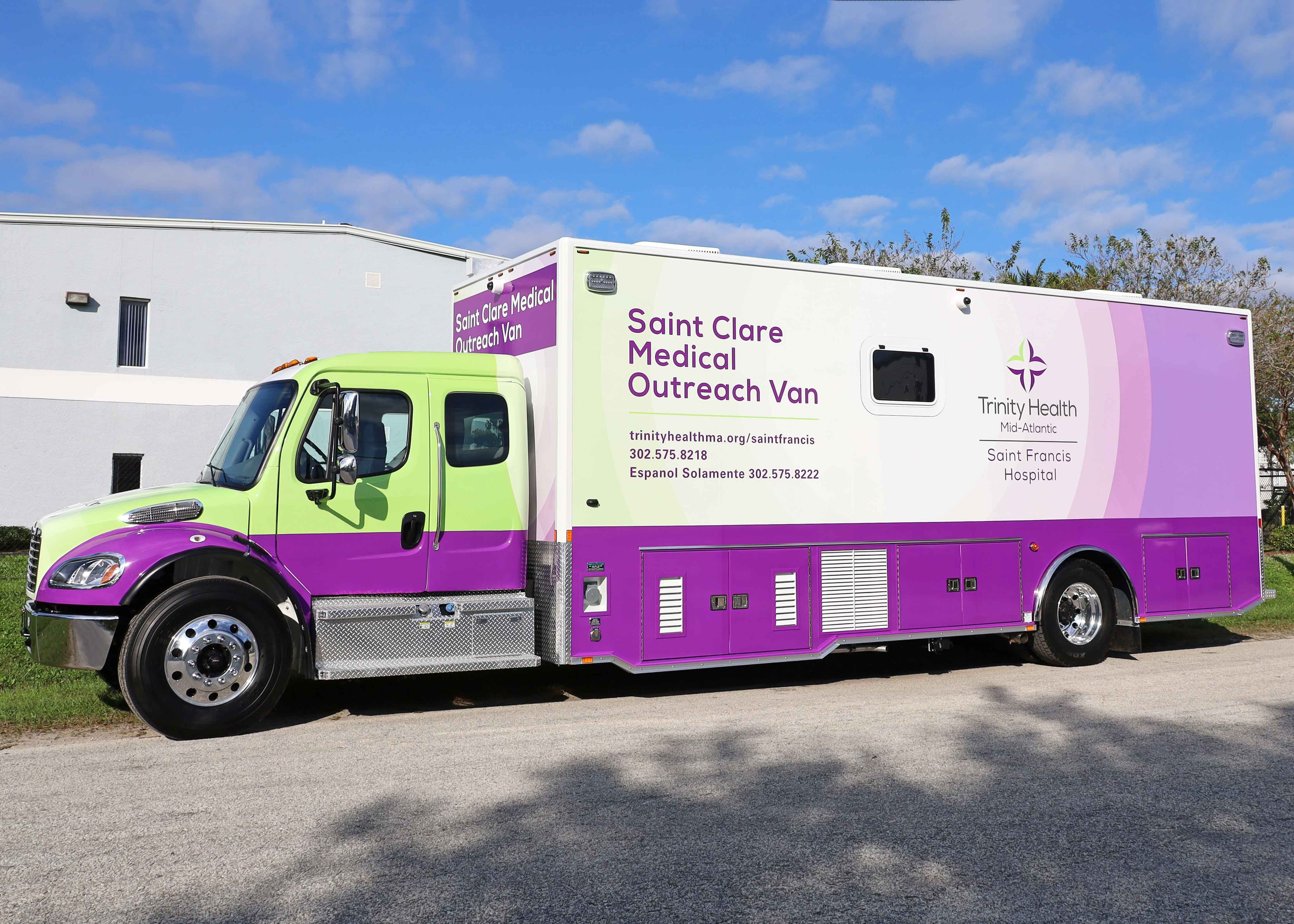 Frontline Communications Specialty Vehicle parked outside on a sunny day.