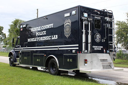 Mobile Crime Lab for Fairfax County Police Department parked outside near the Frontline Communications building on a cloudy day. 