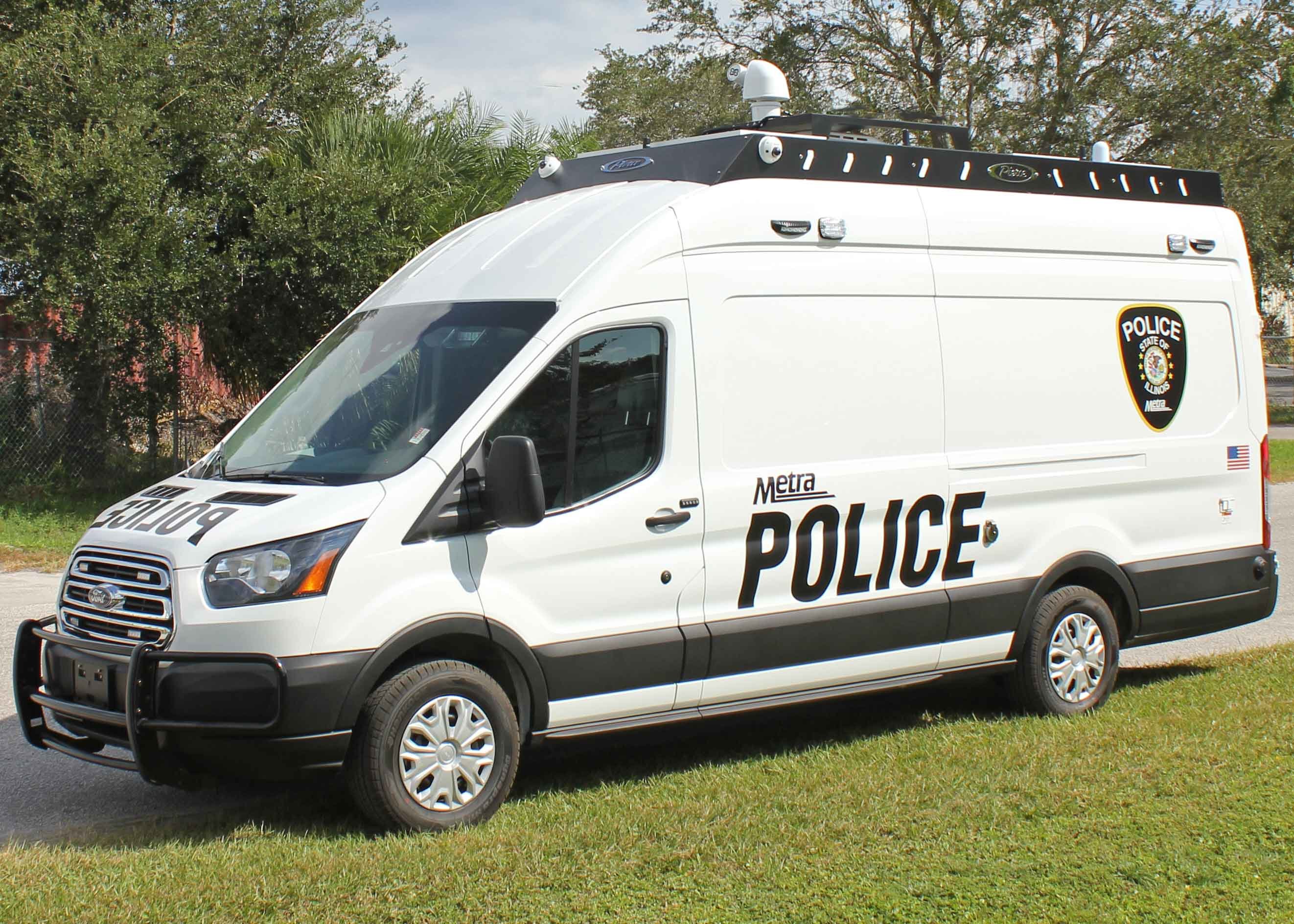 Frontline Communications CRU-22 vehicle parked outside on a cloudy day.