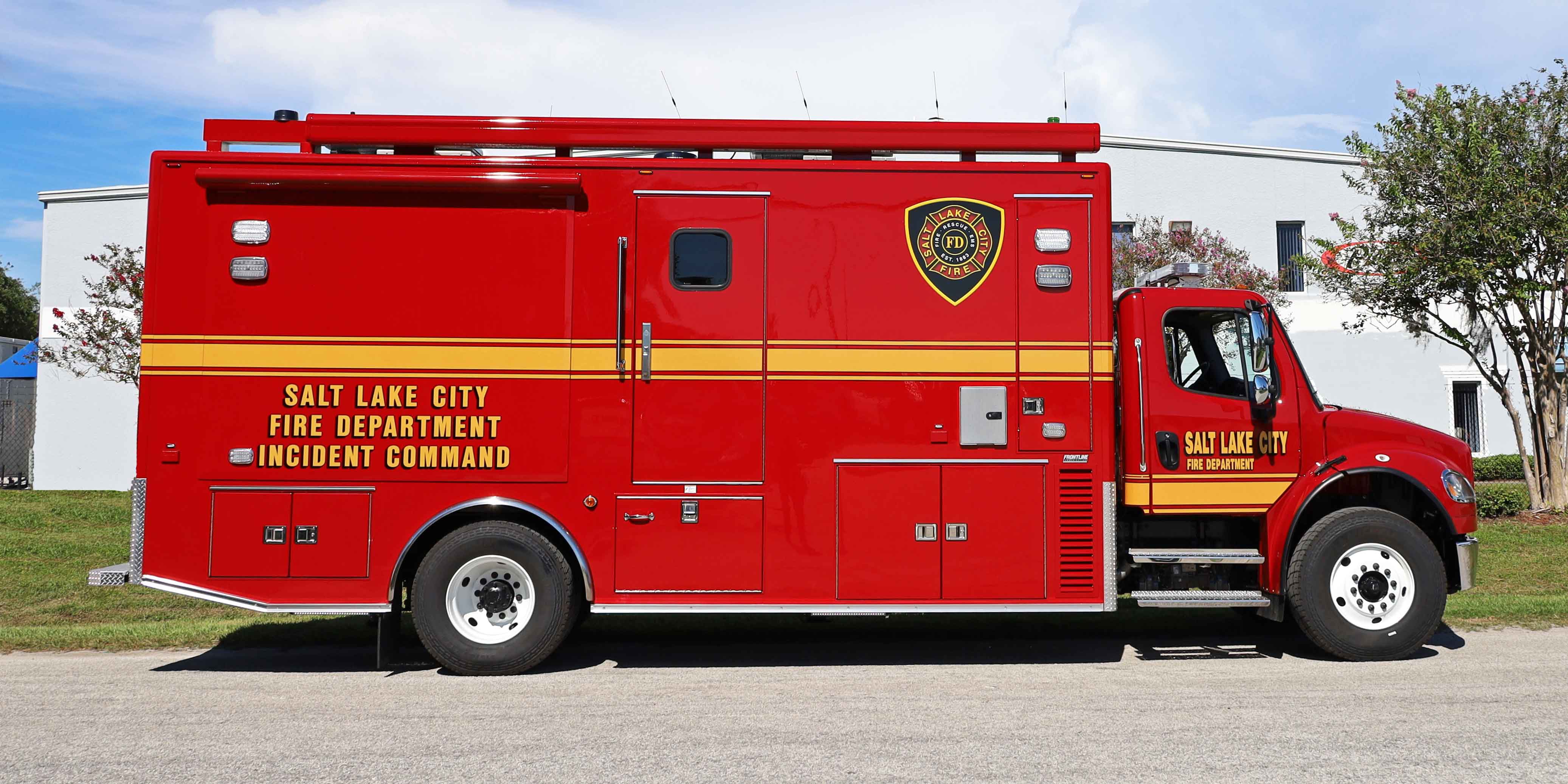 Frontline Communications mid-size mobile command vehicle parked outside on a sunny day.