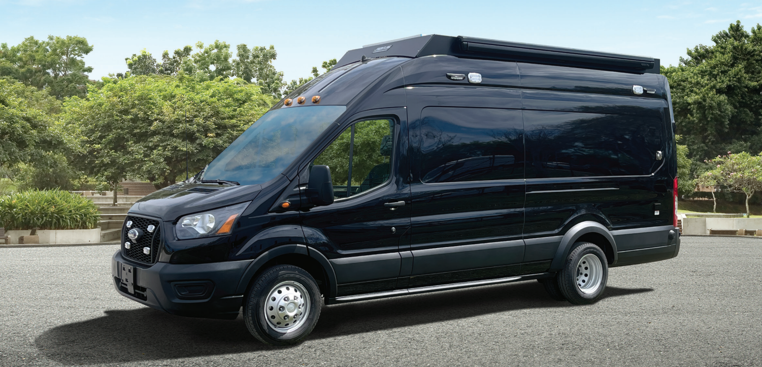 Frontline Communications small mobile command vehicle parked outside on a sunny day.